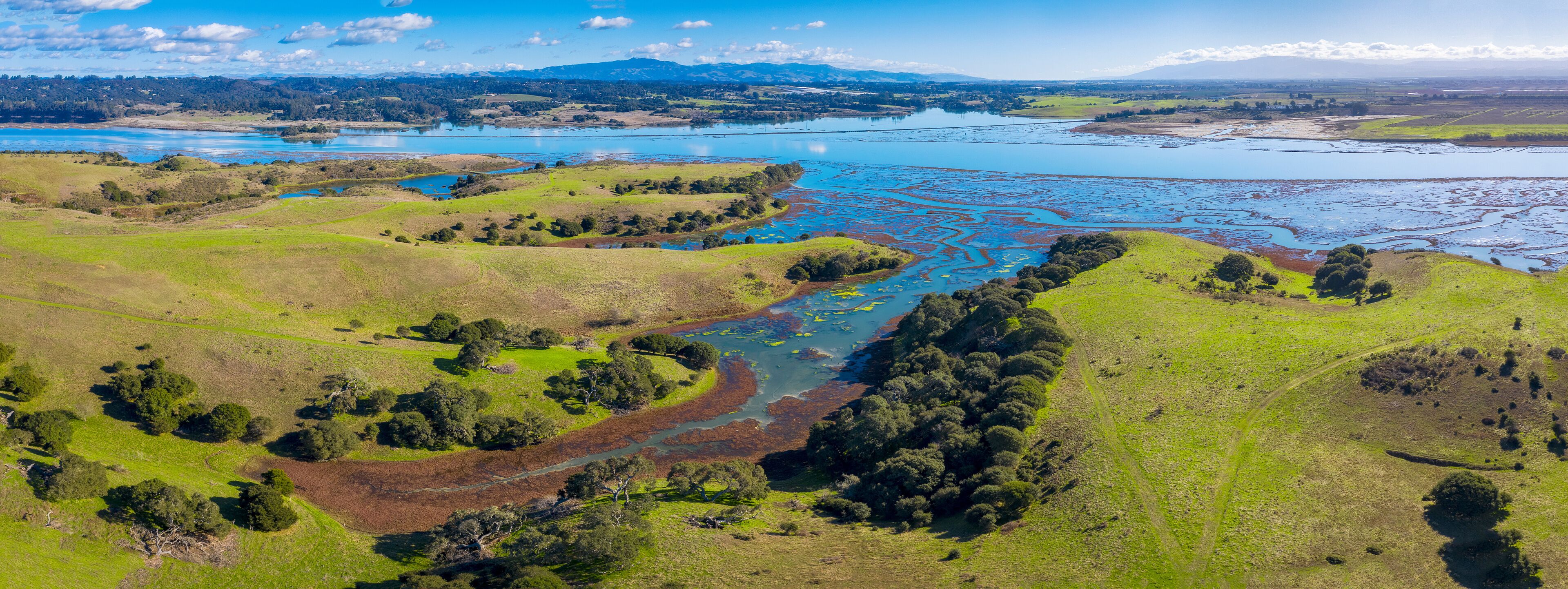 Aerial Panoramic View of Elkhorn Slough, Moss Landing, California. Elkhorn Slough is a 7-mile-long tidal slough and estuary on Monterey Bay in Monterey County, California. 