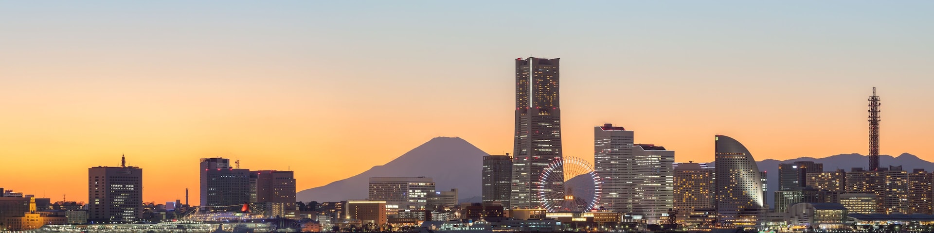 Yokohama skyline at sunset with Mount Fuji in the background, Kanagawa Prefecture, Japan