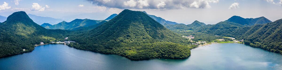 Aerial drone photo - Mt. Haruna rises above Lake Haruna. Gunma Prefecture, Japan.