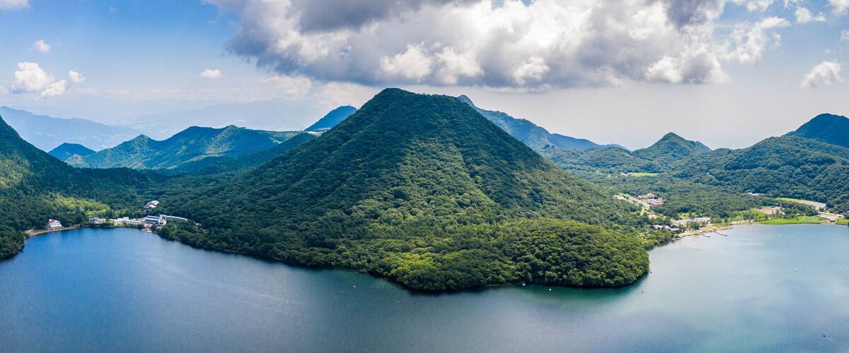 Aerial drone photo - Mt. Haruna rises above Lake Haruna. Gunma Prefecture, Japan.