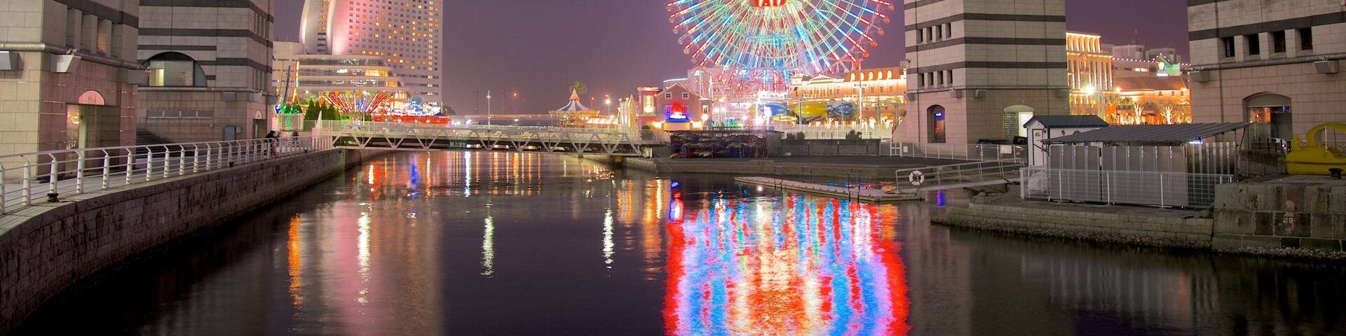 Minatomirai which includes a river or creek, a high rise building and a city