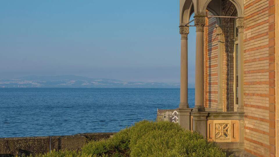 A coastal building with a view of the sea.