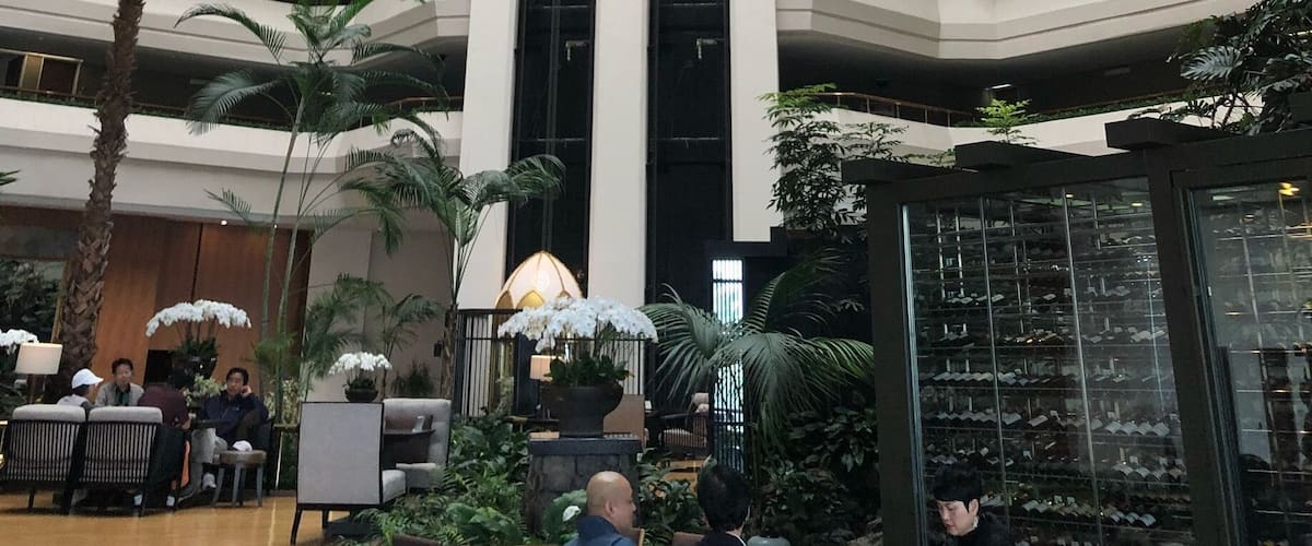 A multi-level atrium with a central glass dome and multiple floors.