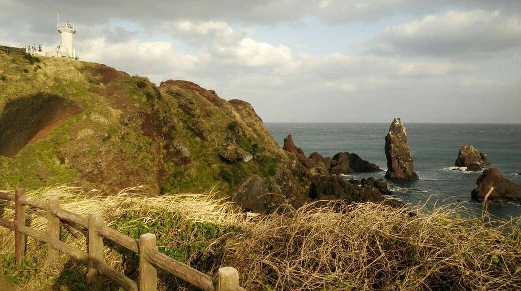The famous lighthouse at Seopjikoji Coast, Jeju. Very windy.