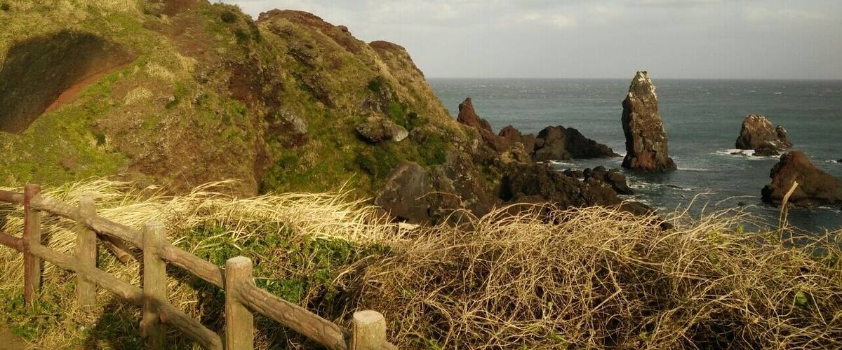 The famous lighthouse at Seopjikoji Coast, Jeju. Very windy.