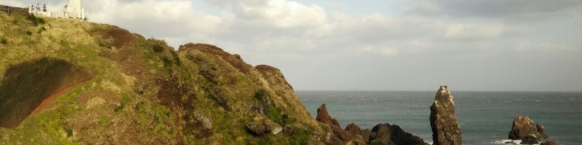 The famous lighthouse at Seopjikoji Coast, Jeju. Very windy.
