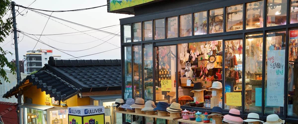A store with a variety of hats displayed outside.