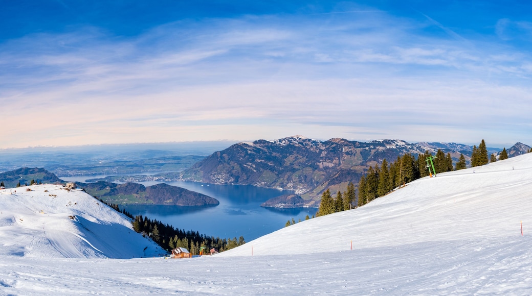 Panorama of Klewenalp mountains and Lake Lucerne or Vierwaldstattersee from mountain peak covered with snow. Popular ski resort in Swiss Alps and winter sport attraction in Switzerland in winter