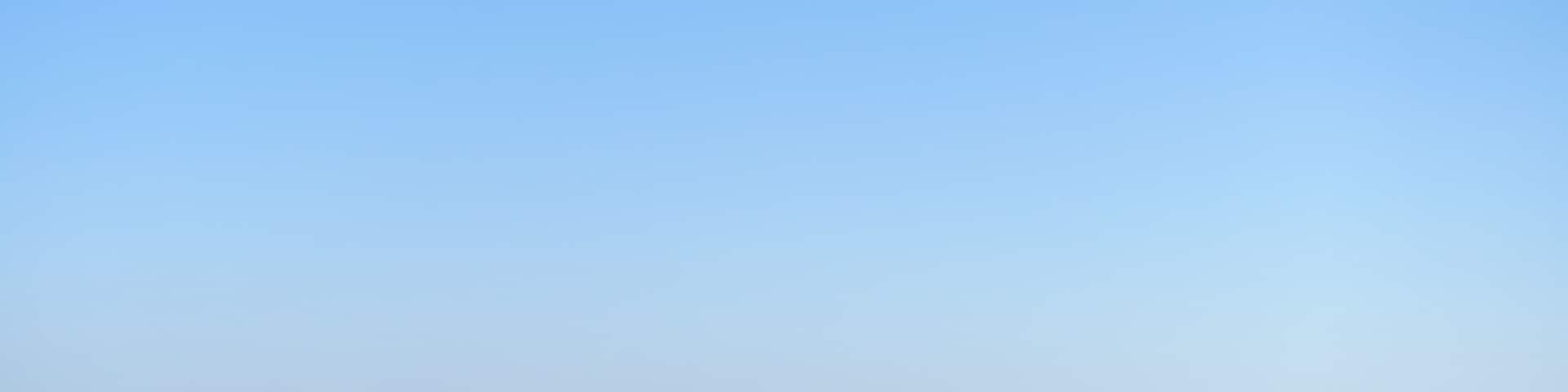 Background texture of elevated Melbourne 's metropolitan view of western suburbs. Aerial view of suburban houses against cloudless blue sky.