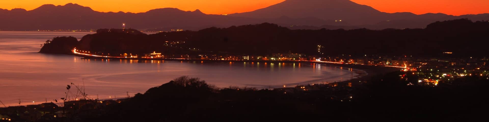 Kamakura featuring general coastal views, landscape views and a sunset