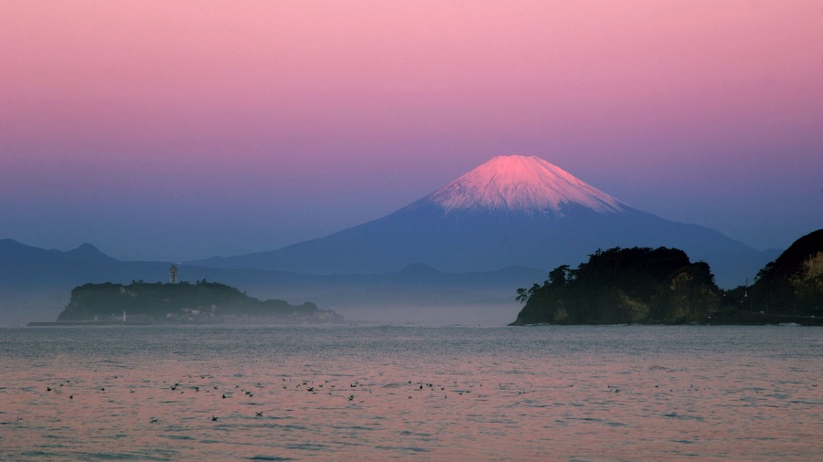 Kamakura which includes general coastal views, a sunset and landscape views