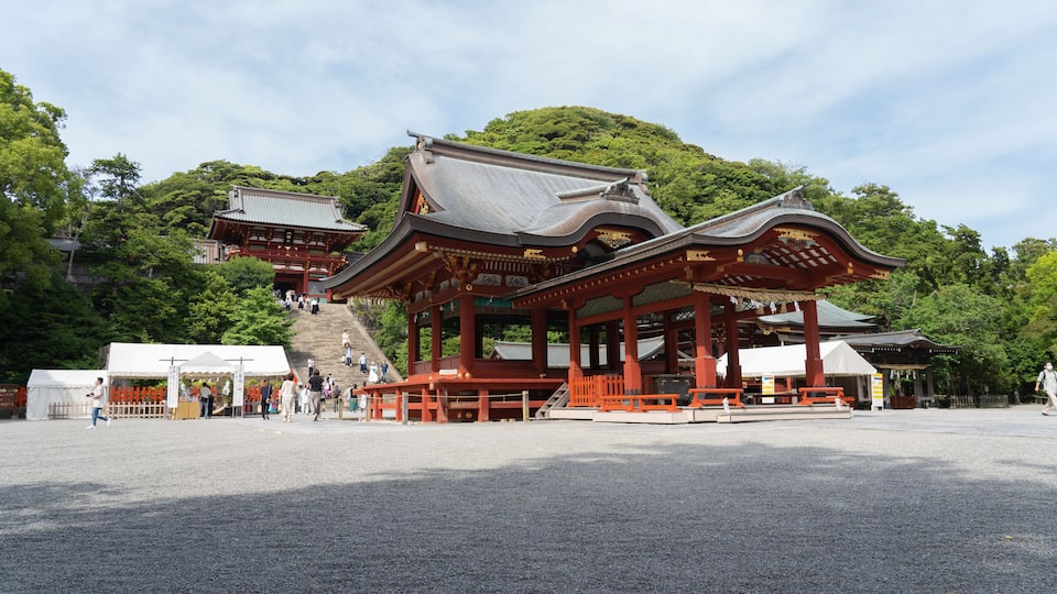 A traditional Japanese temple with a red roof and wooden structure.
