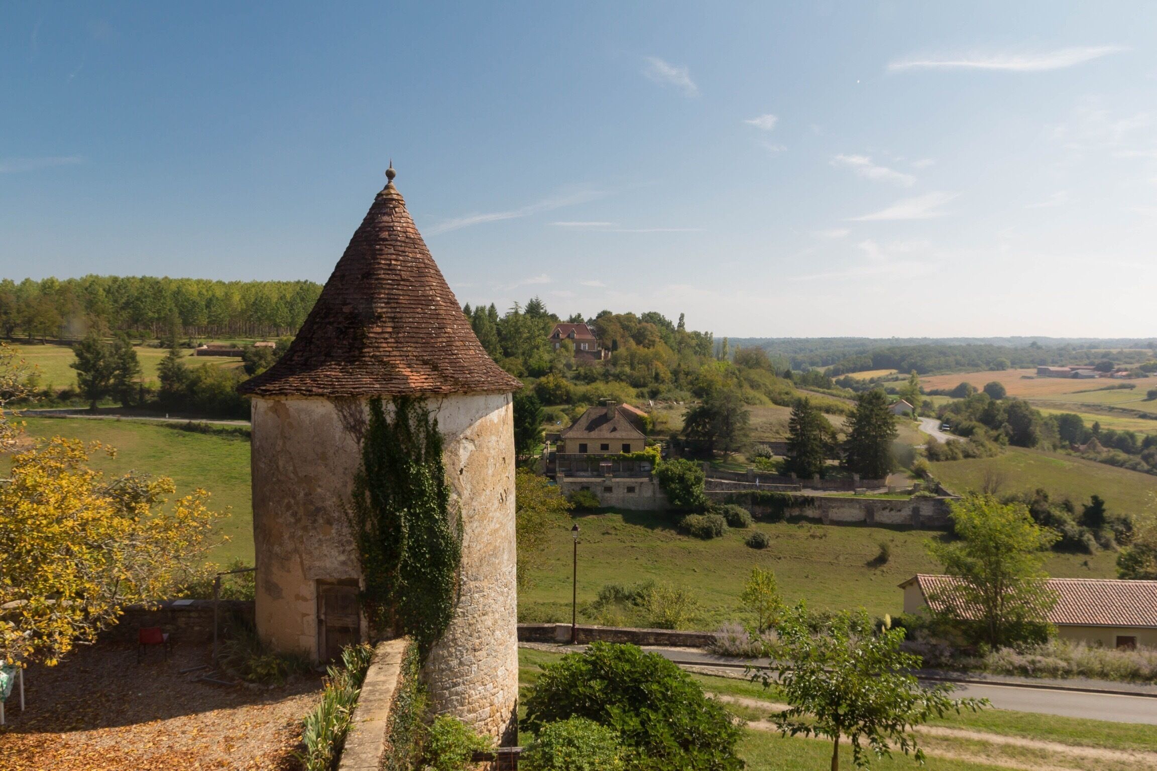 One of the old bastides that still has its exterior wall mostly intact, Monpazier has spectacular views of the French countryside #county #rural #france #roadtrip