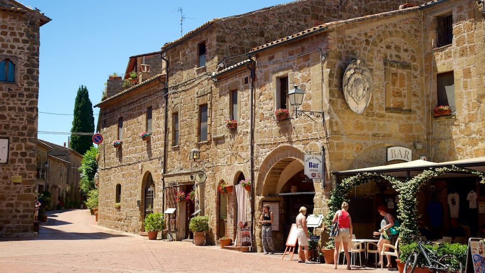 A stone building with a bar and outdoor seating.