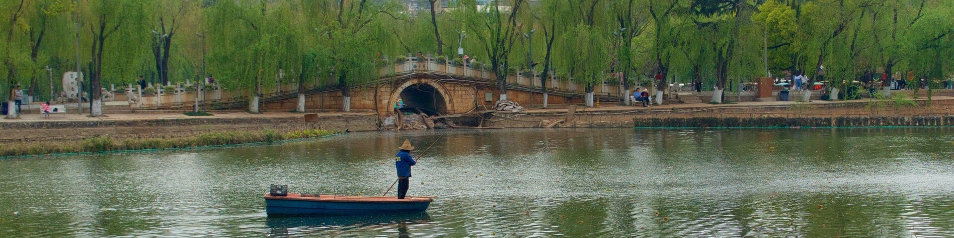 Green Lake Park featuring a river or creek, a city and boating