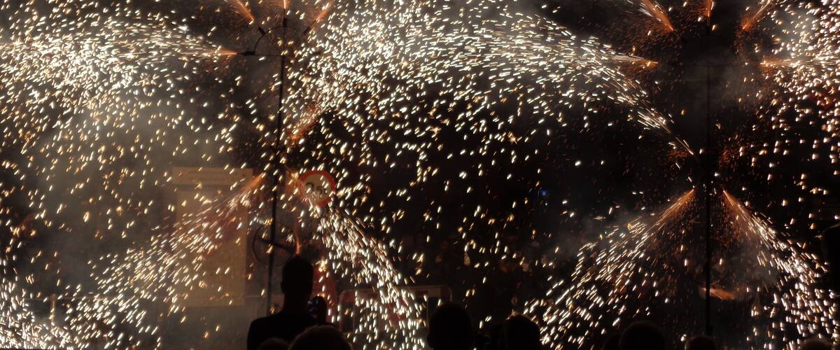 Fireworks exploding in the night sky.