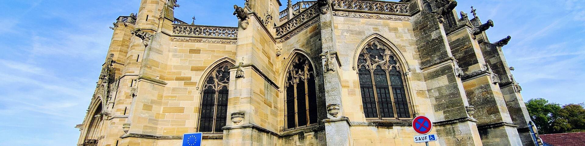 A historic cathedral with intricate Gothic architecture, including pointed arches and detailed stonework.