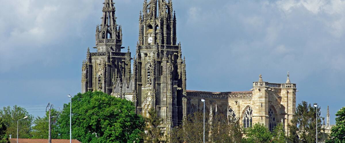 A Gothic cathedral with two tall spires and intricate stonework.