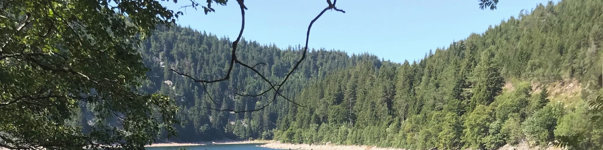 Lac Blanc, the upper of two glacial lakes in the Voges Alsace France.
This is the âwhiteâ lake at 1050m altitude with an awesome 300m hiking possibility straight up bouldering for an awesome view.
The âblackâ lake, Lac Noir is a little smaller and at an altitude of 950m also a nice walk to combine the two. Good pauzing possibilities wit huts and Auberges for drinks, resting and something good to eat as well.
Both are now used for hydro-power-generation so unfortunately swimming is not allowed.
