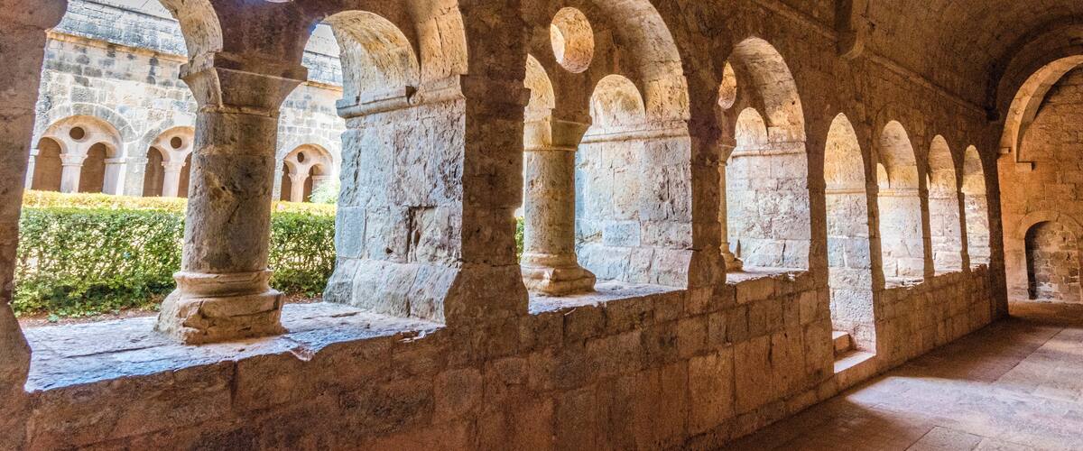 A series of stone arches in a historical building.