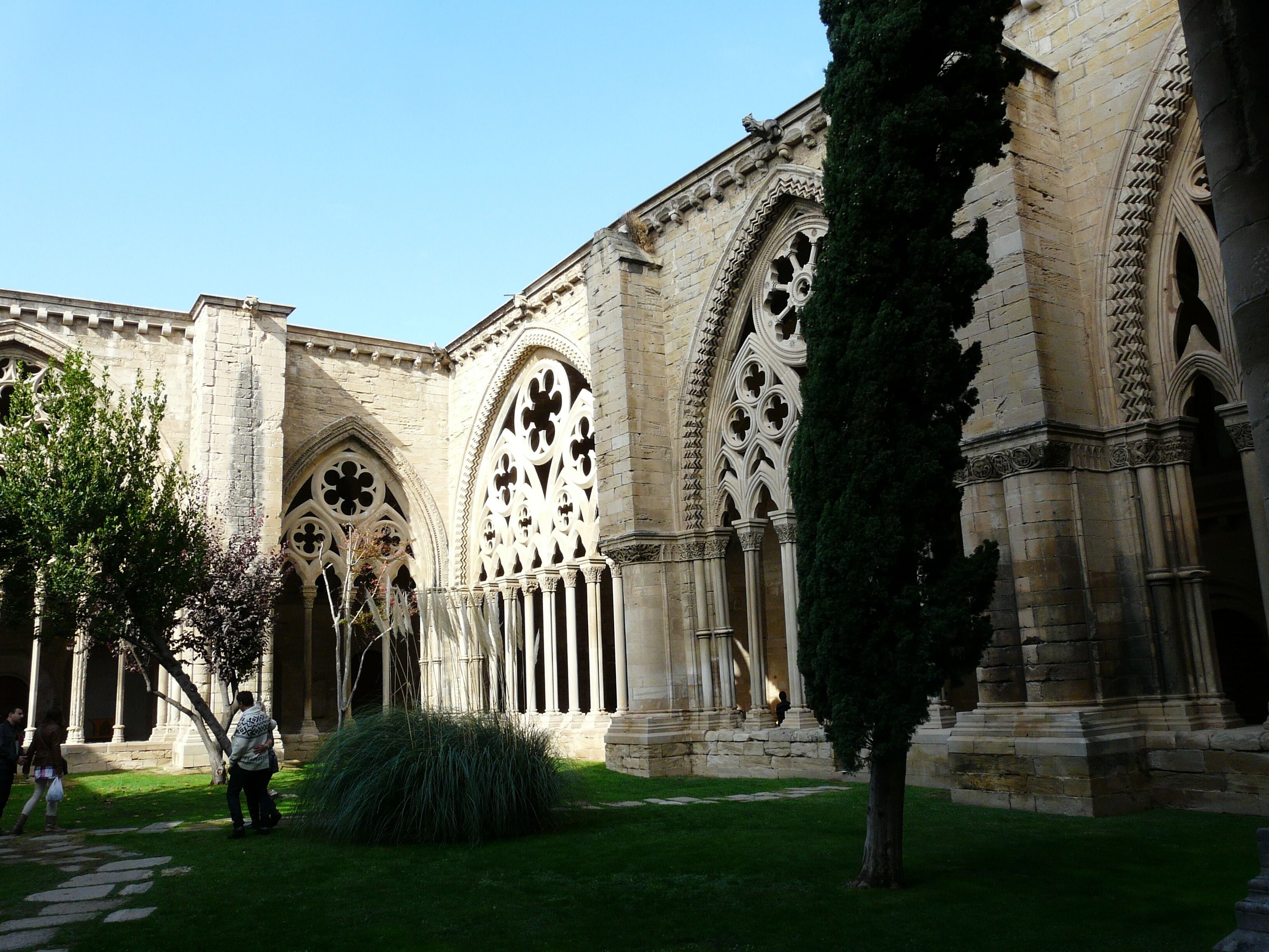 A historic building with Gothic architecture, featuring pointed arches and intricate stone carvings.