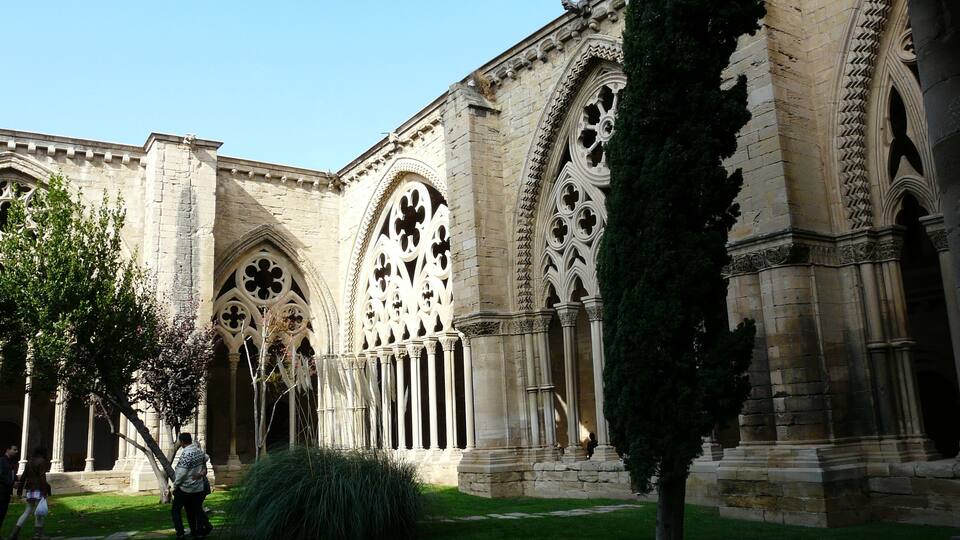 A historic building with Gothic architecture, featuring pointed arches and intricate stone carvings.