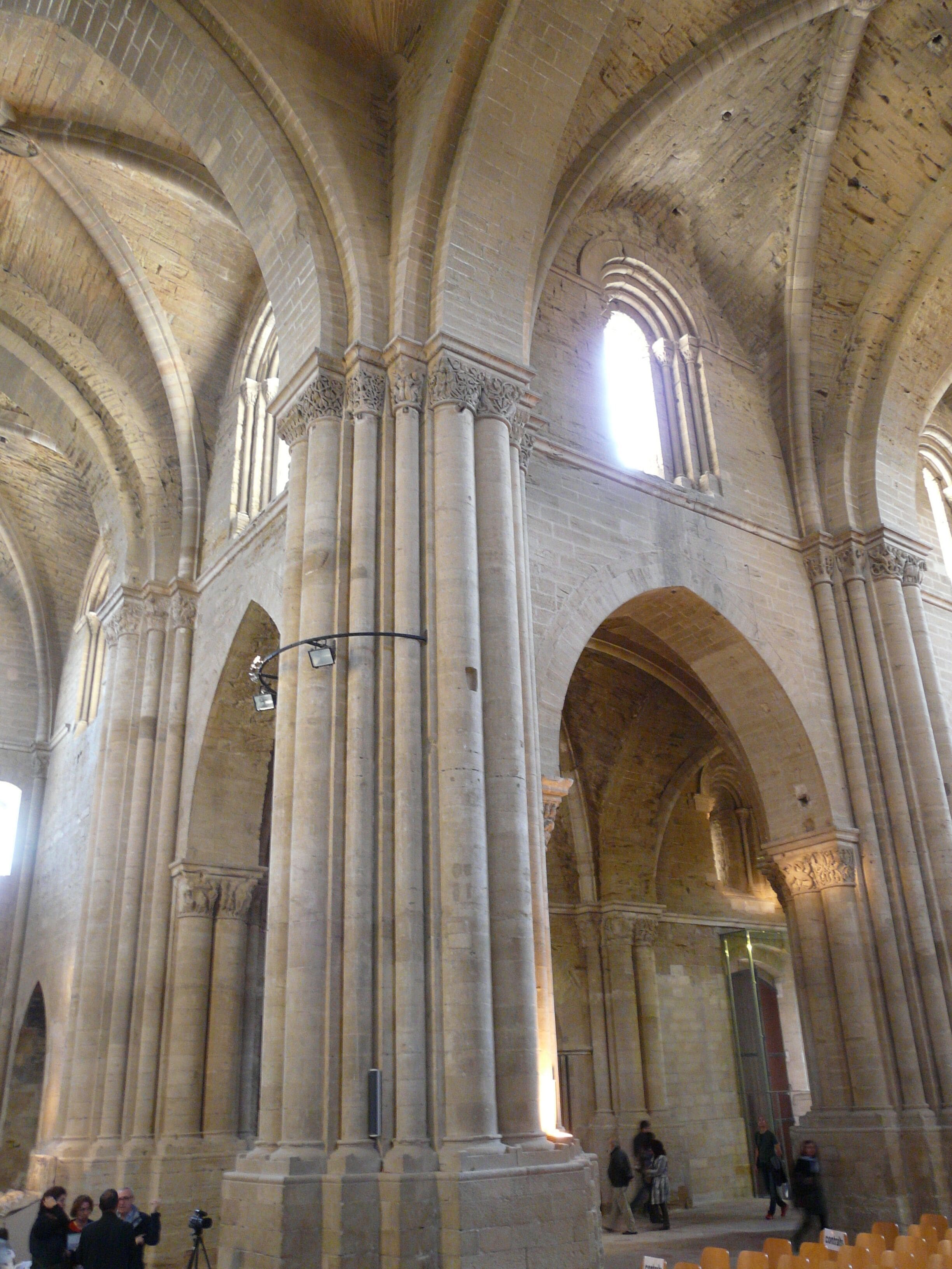 A cathedral interior with high vaulted ceilings and large columns.