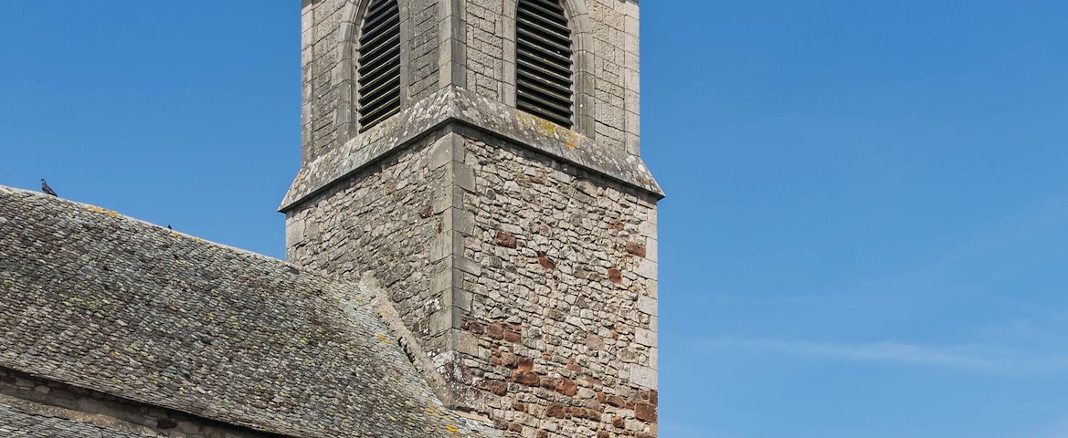 Bell tower of the church of Saint-Mayme in commune of Onet-le-Château, Aveyron, France
