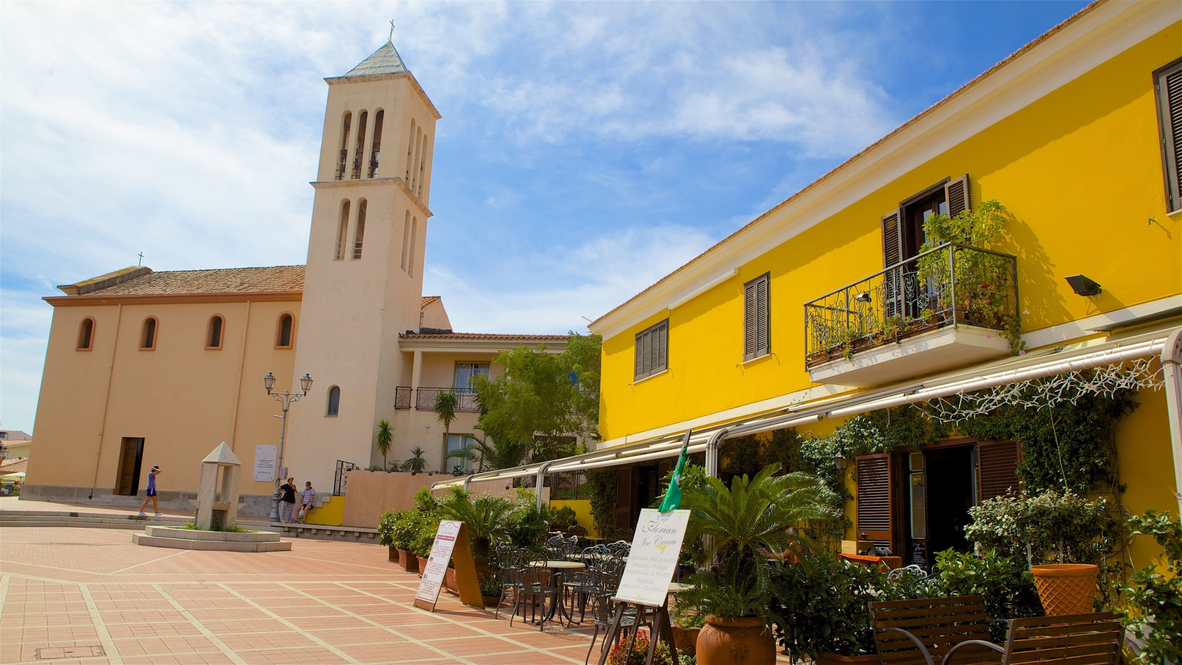 Sardinia which includes outdoor art and a square or plaza