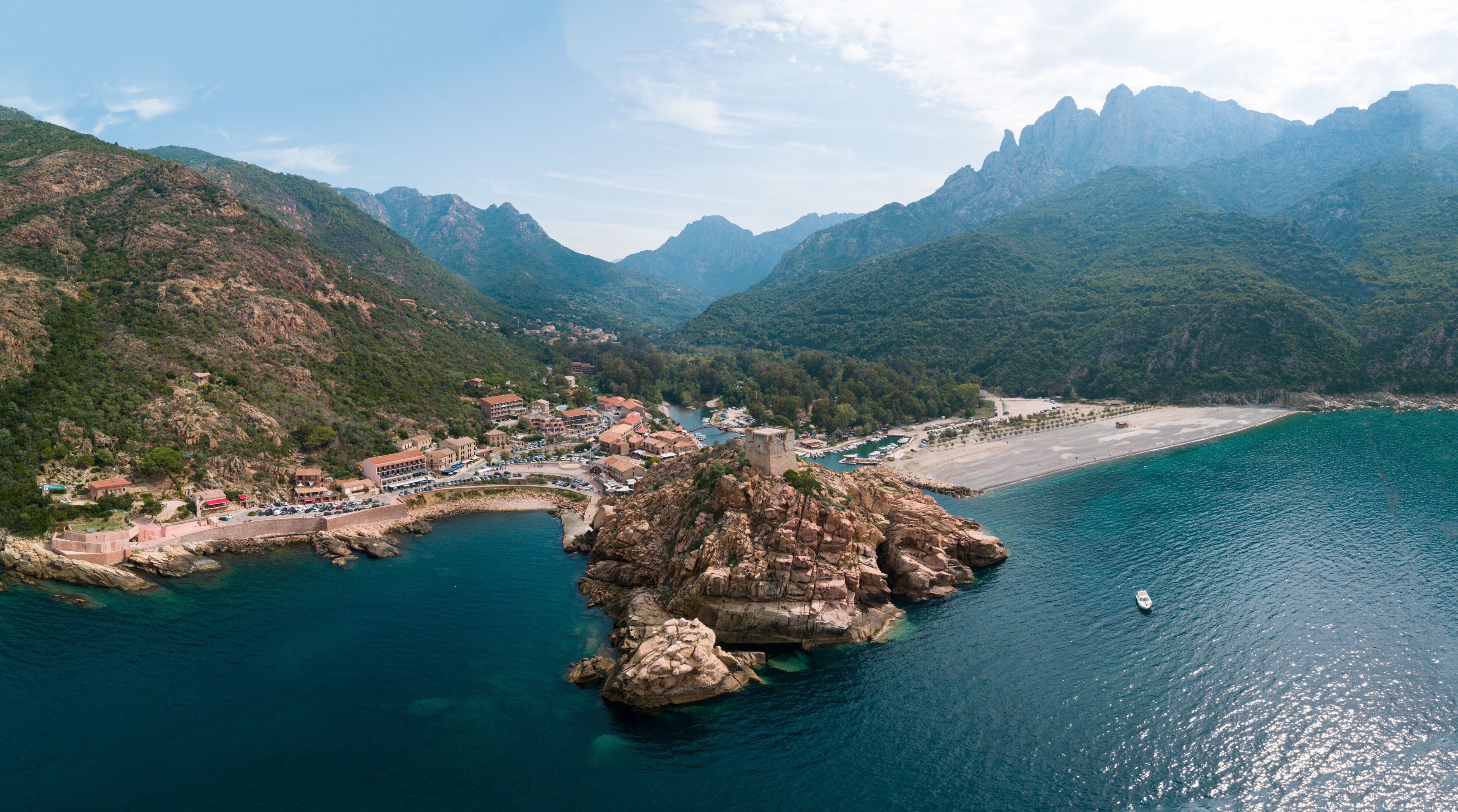 Drone photography of Calanches Piana and Porto ota city with rock cliffs and turquoise waters in Cap Corse