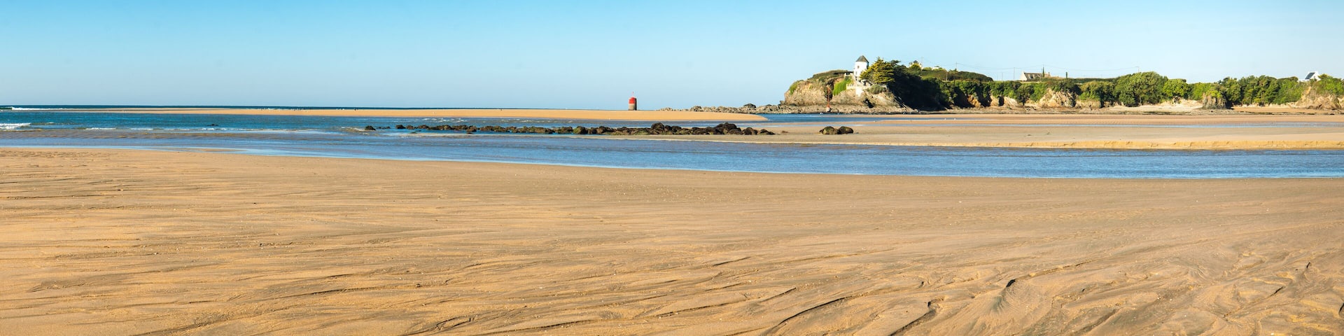 Guidel morbihan clohars carnoet finistere Low Tide Sandy Beach with Distant Lighthouse