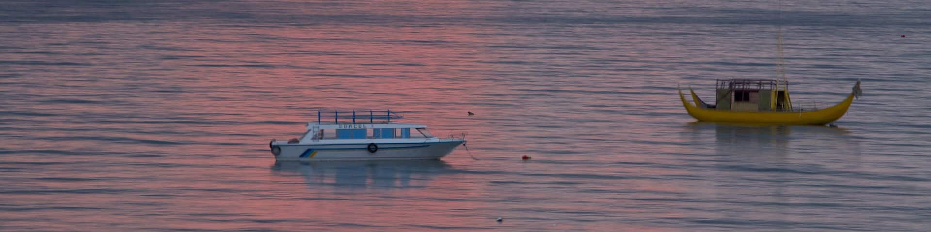 Copacabana featuring general coastal views, boating and a sunset