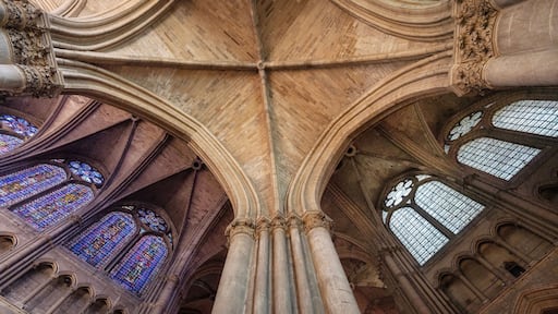 stained glass windows and ceiling of famous cathedral in french city of reims
