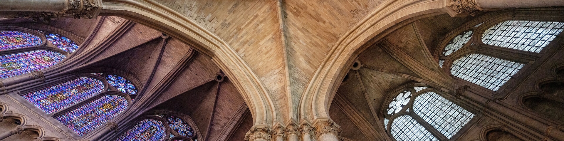 stained glass windows and ceiling of famous cathedral in french city of reims