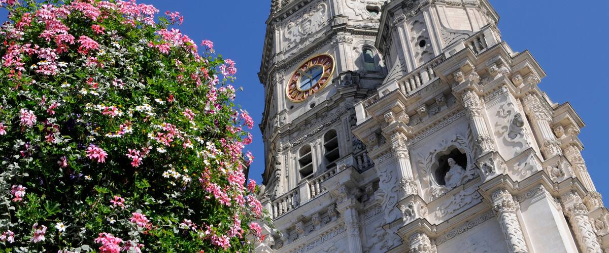 A historic building with intricate architecture and a clock tower.