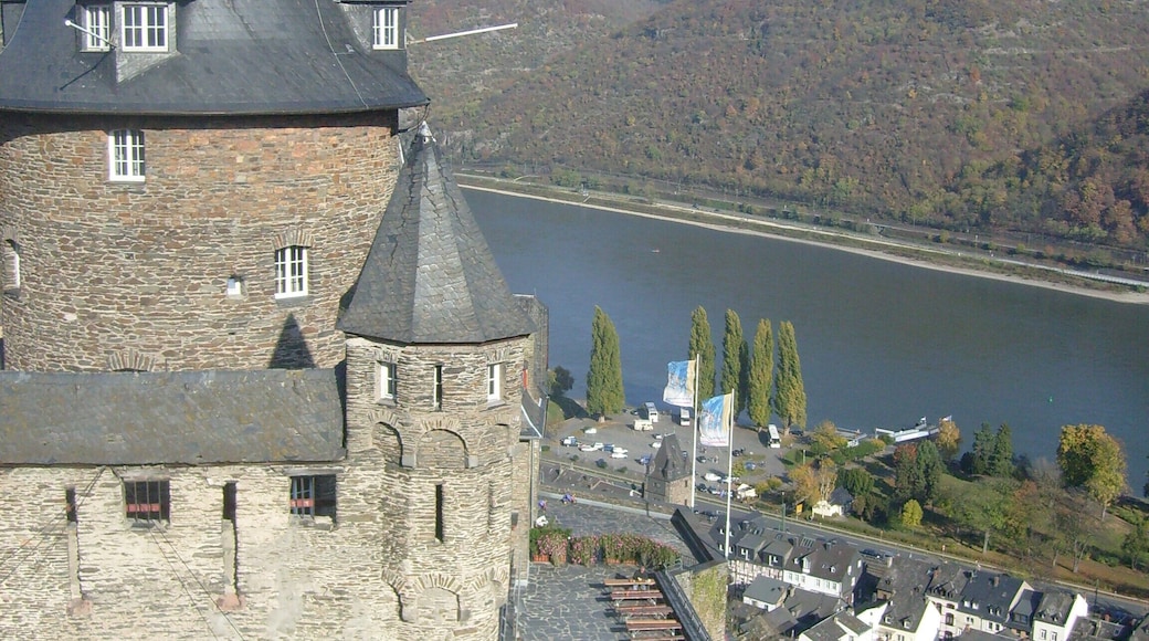 View from the top of the bulwark onto the castles terrasses, the city of Bacharach and the rhine valley.
