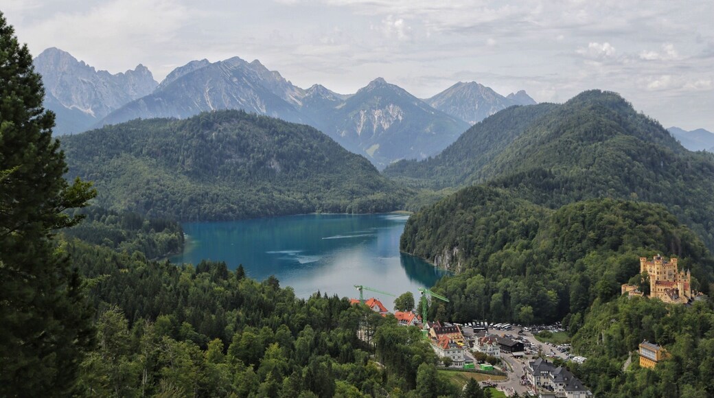 An overview of King Ludwig's childhood home, Hohenschwangau Castle in the right side of the photo with the Alpsee Lake in the center. Be sure to book lots of time here and wander onto the hiking trails all around the area. Such a magical area to visit in Bavaria.
#takeahike #europe