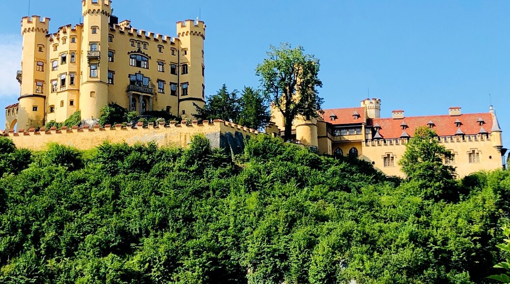 Hohenschwangau Castle or Schloss Hohenschwangau is a 19th-century palace in southern Germany. It was the childhood residence of King Ludwig II of Bavaria and was built by his father, King Maximilian II of Bavaria. It is located in the German village of Hohenschwangau near the town of Füssen, part of the county of Ostallgäu in southwestern Bavaria, Germany.