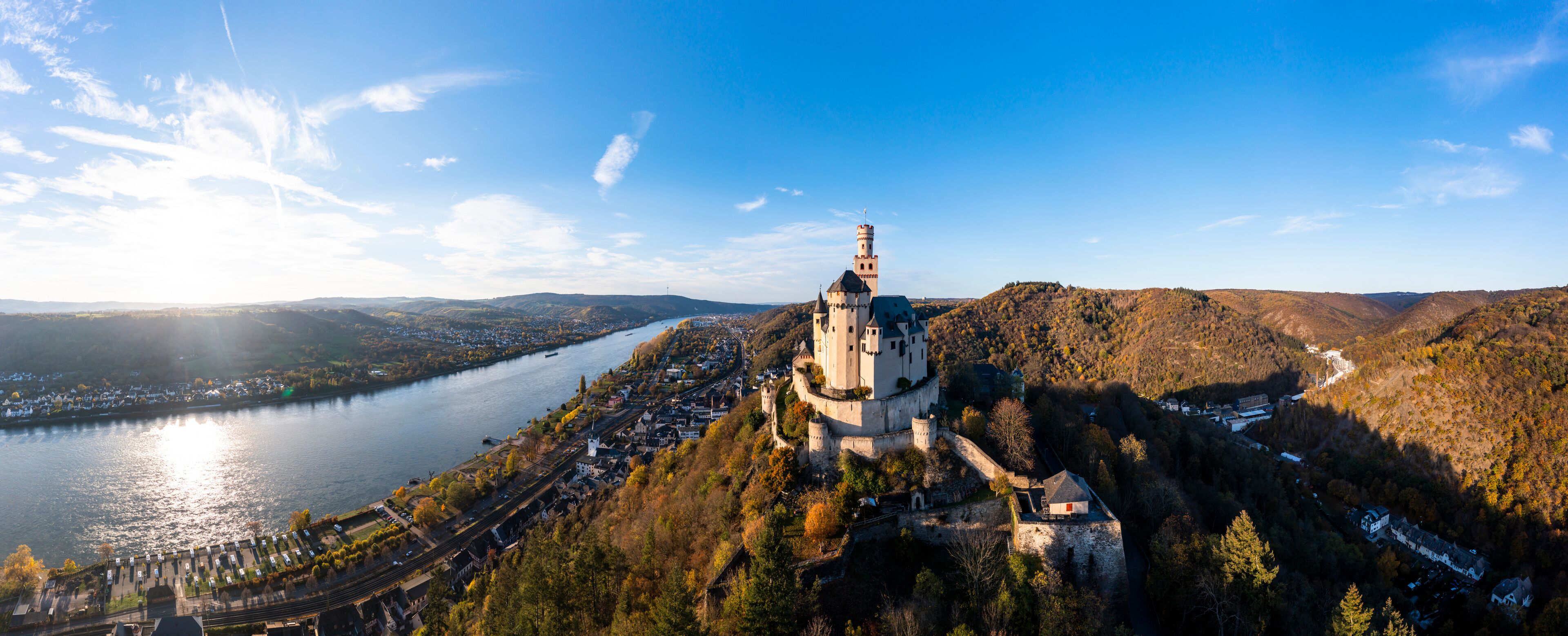 Germany, Rhineland-Palatinate, Braubach, Aerial panorama of Marksburg castle overlooking Rhine Gorge at autumn sunset