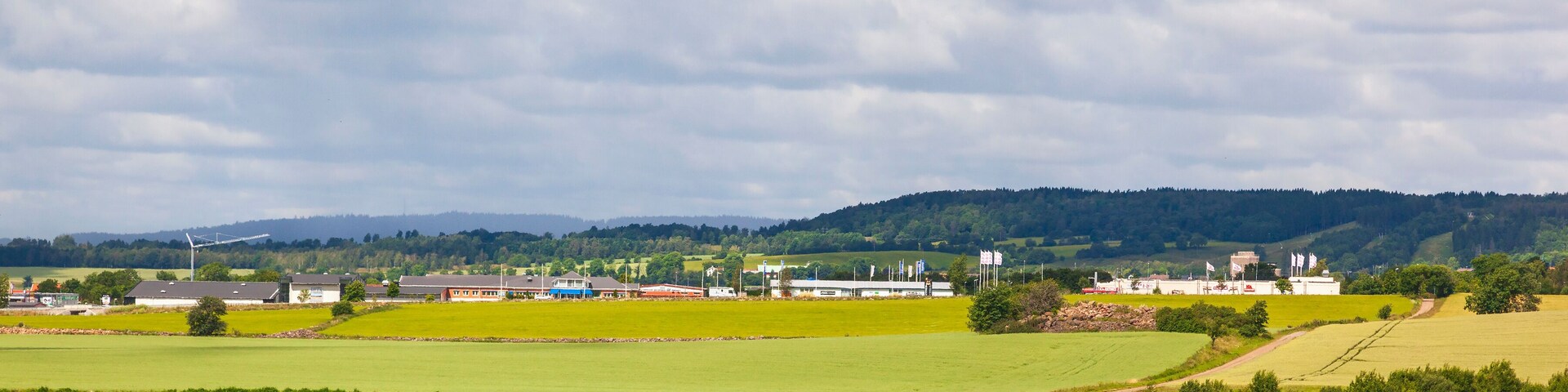 Gravel road towards Falkoping a Swedish town in the countryside