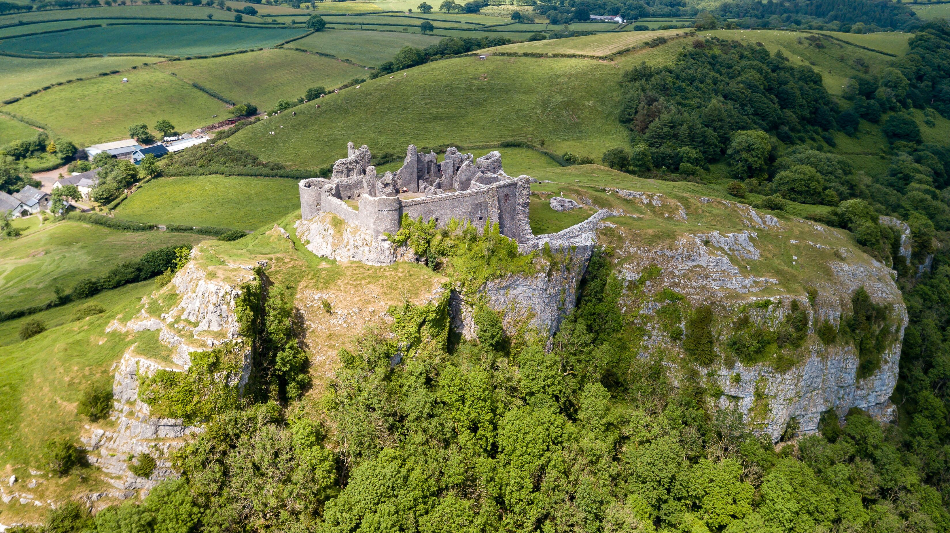 Aerial view of the ruins of Carreg Cennen Castle in the Camarthenshire countryside
