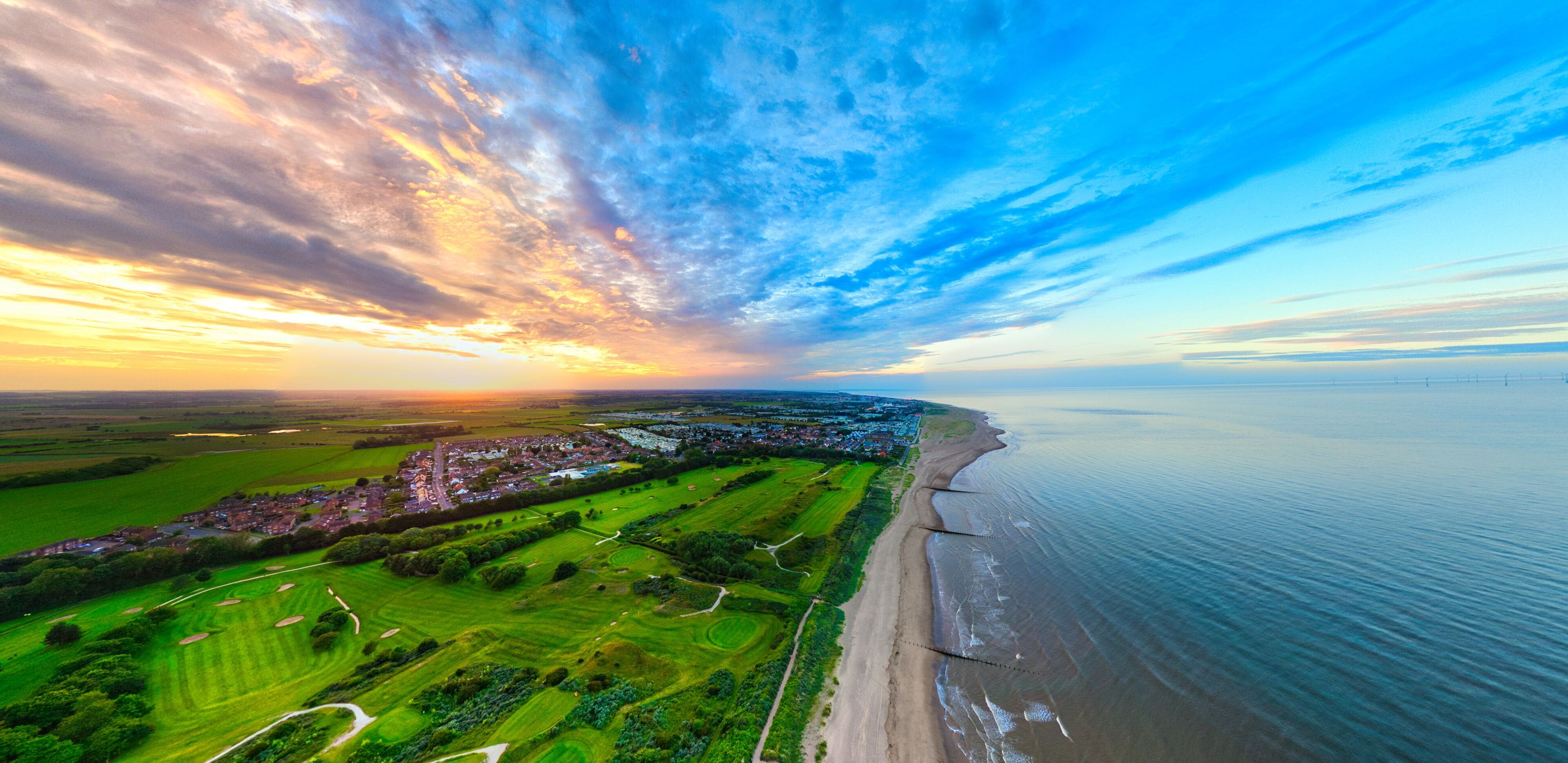 Panorama of the popular seaside holiday resort of Skegness on the east coast of england. Warm summer tones and sweeping vista views