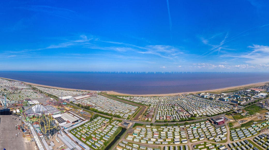 Aerial wide photo of the town centre of Skegness showing the the sandy beach near fairground rides in the East Lindsey district of Lincolnshire, England