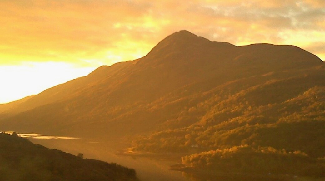 In Kinlochleven, Scotland. Kinlochleven is in the Scottish Highlands and is the penultimate stop on the West Highland Way. I had a memorable time there in October 2015! And got a great shot here, with the sunset on the mountain! In fact, this sunset was one of my favorite moments of that entire Scottish trip. Watching the sunset evolve was simply spectacular...
