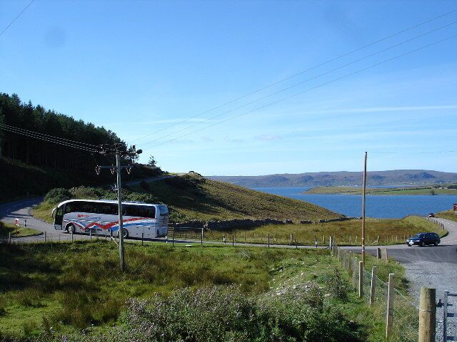 Coach on the hairpin above Drumchork. Loch Ewe in the background.