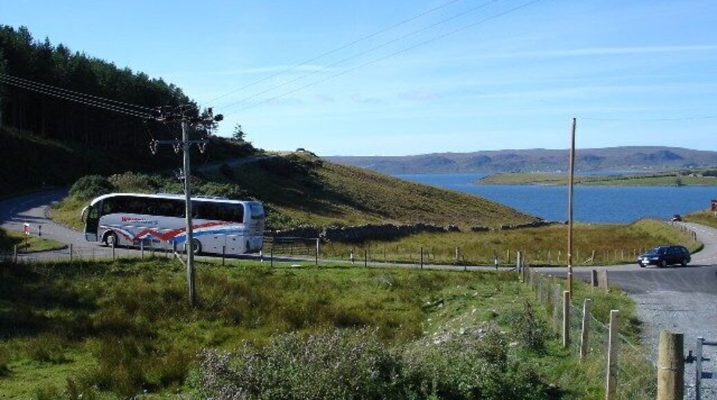 Coach on the hairpin above Drumchork. Loch Ewe in the background.