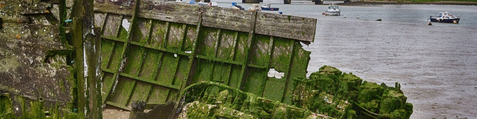 With its shores opening up to industrial and natural areas this is a great place to explore.
I parked up beneath the bridge and followed the footpath along the river. There's plenty to see such as the remains of this old boat, its engine which once upon a time propelled it through the water, now idle and covered in seaweed.
#Beachbound #Abandoned