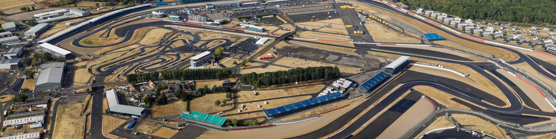 An aerial view of a complex race track with multiple loops and turns.