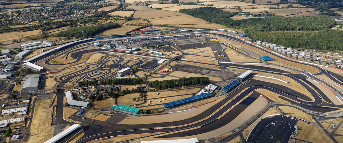 An aerial view of a complex race track with multiple loops and turns.