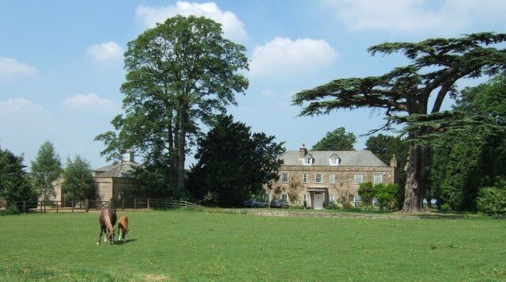 West Park Farm. A mare and her foal nibble the grass in front of West Park Farm. Near to Whittlebury this lovely old farm obviously belonged to a Gentleman Farmer in the past. Much of its land is now taken over by Whittlebury Park Golf Course.